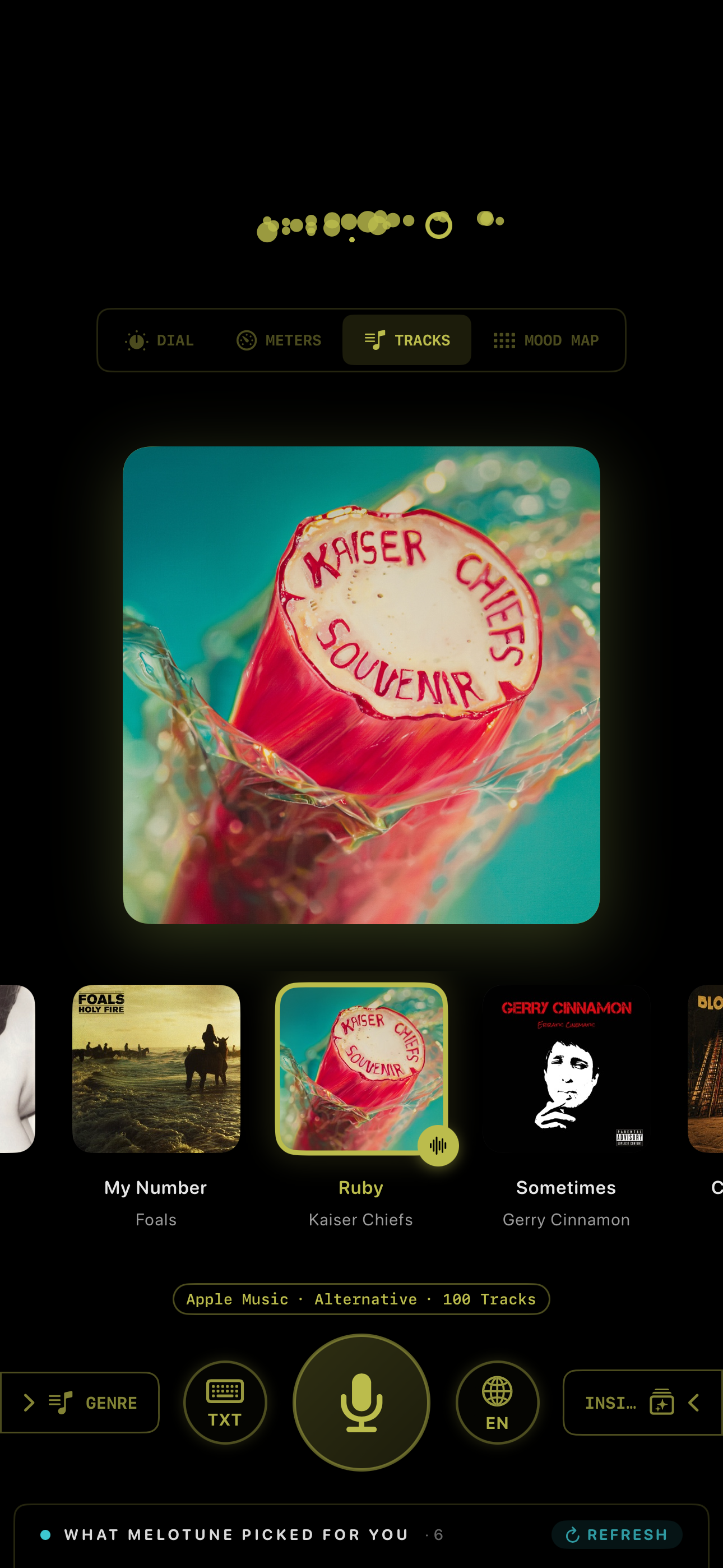 MeloTune Tracks mode — Kaiser Chiefs Souvenir album art in amber/olive mood with Apple Music alternative 100 tracks queue